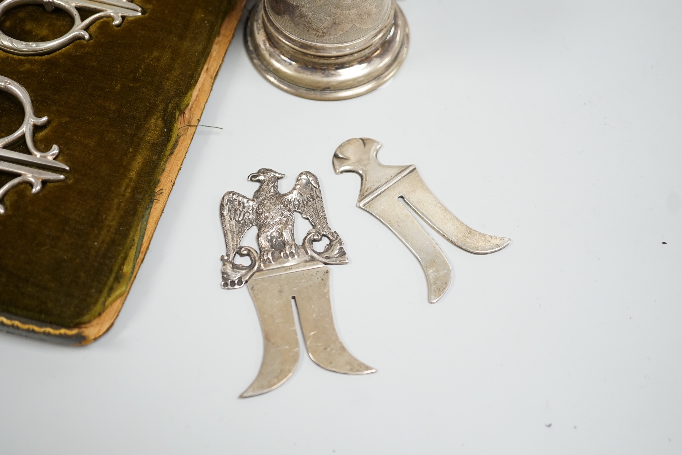 Judaica - a cased pair of scissors, a Tzedakah box, a Victorian silver circumcision guard, London 1888 and a similar plated example